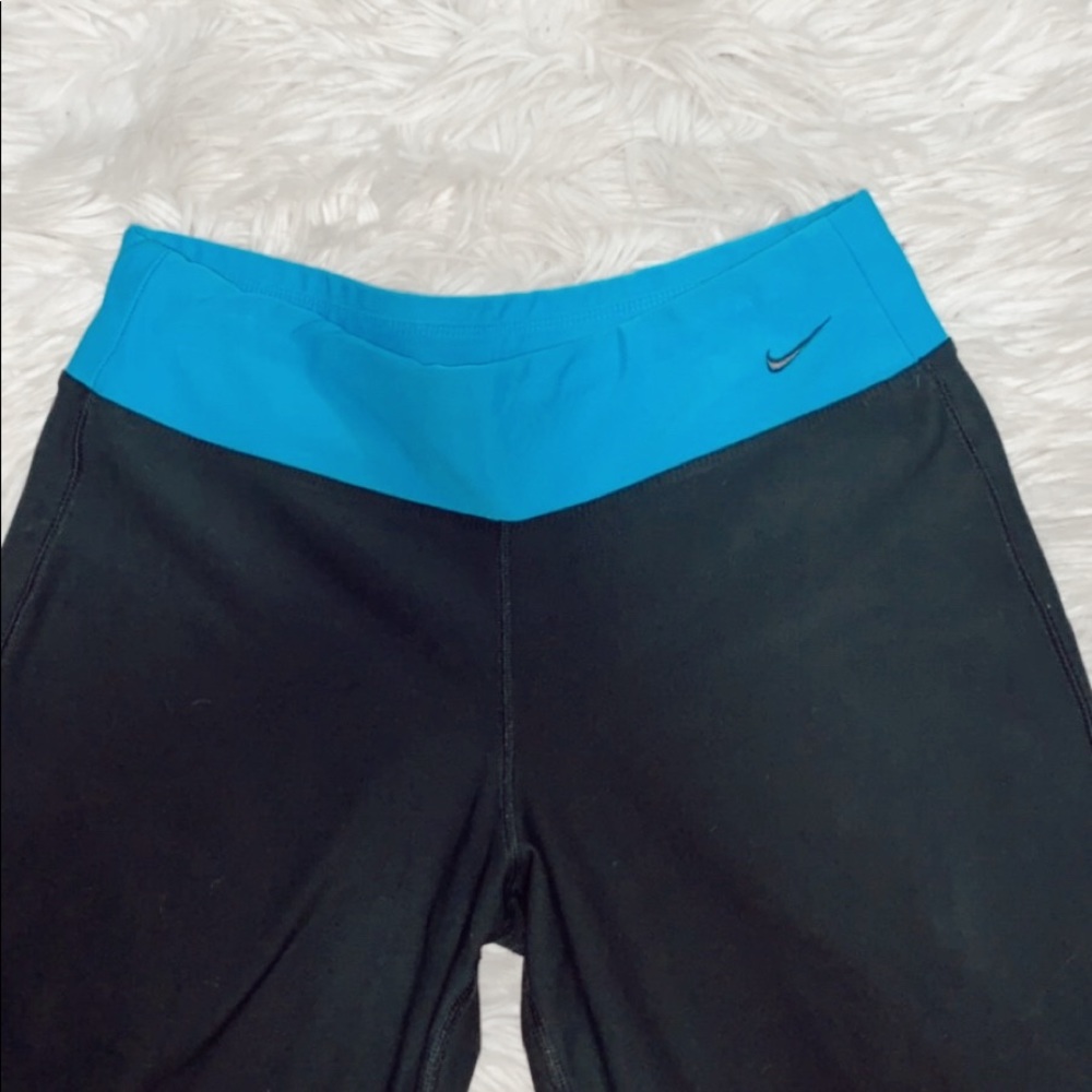 black nike bootcut yoga pants w/ blue waistband